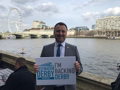 Brendan Clarke Smith MP holding an 'I'm backing Derby' sign