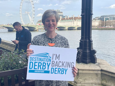 Lilian Greenwood MP holding an 'I'm backing Derby' sign
