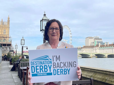 Pauline Latham MP holding an 'I'm backing Derby' sign