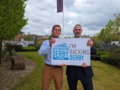 Colleagues from Resonate holding an 'I'm backing Derby' sign