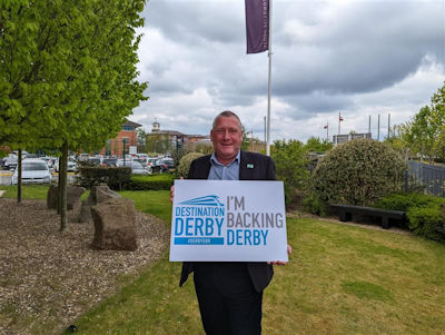 Rupert Brennan Brown holding an 'I'm backing Derby' sign