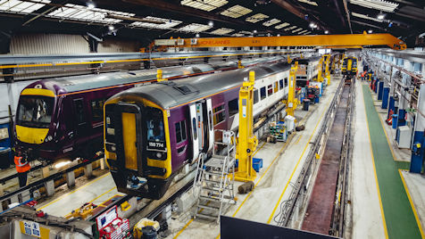 Two trains being worked on at Alstom Derby