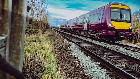 East Midlands Railway train travelling on train track